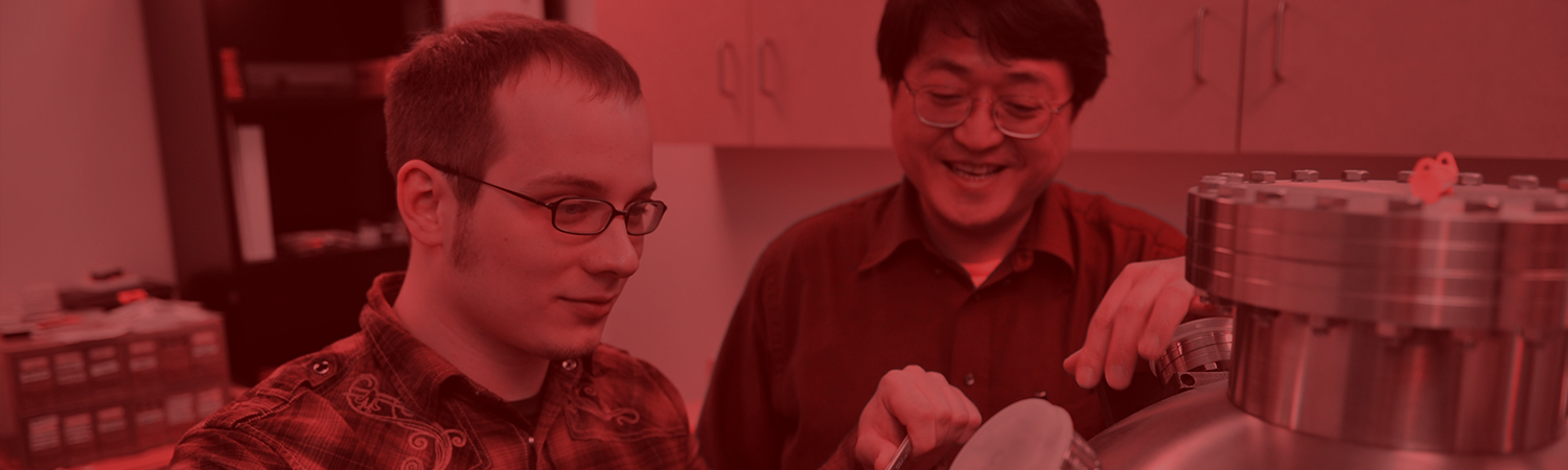 Student and professor working on a lab